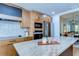 Well-equipped kitchen featuring a granite island, modern appliances, and stylish wood cabinets at 829 E Lime St, Lakeland, FL 33801