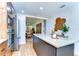 Modern kitchen with stainless steel appliances, island, and wood cabinets at 829 E Lime St, Lakeland, FL 33801