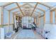 Spacious shed with wooden beams, storage shelving, and a durable wooden floor at 829 E Lime St, Lakeland, FL 33801