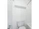 Bright bathroom featuring a toilet, shower, and a shelf above the toilet at 4215 S Semoran Blvd # 3, Orlando, FL 32822