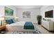Comfortable bedroom with a lush green accent wall, and bright decor at 4215 S Semoran Blvd # 3, Orlando, FL 32822