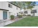 Exterior view of a multi-Gathering home with a landscaped courtyard and a private balcony at 4215 S Semoran Blvd # 3, Orlando, FL 32822