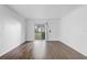 Spacious living room with hardwood floors and a large sliding glass door for ample natural light at 4215 S Semoran Blvd # 3, Orlando, FL 32822