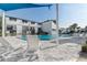 Community pool features a relaxing space with lounge chairs, and building view at 4215 S Semoran Blvd # 3, Orlando, FL 32822