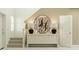 Inviting foyer with a console table, decorative lamps, and a staircase leading to the upper level at 951 Hour Glass Rd, Lakeland, FL 33801