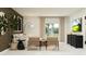Cozy living room with comfortable seating, a large window, and a television at 951 Hour Glass Rd, Lakeland, FL 33801