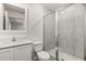 Modern bathroom with glass shower doors, white cabinets, and a sleek design at 1795 White Elephant Loop, Winter Haven, FL 33884