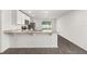 Contemporary kitchen with stainless steel appliances, granite countertops, and ample natural light at 1795 White Elephant Loop, Winter Haven, FL 33884