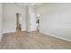 Spacious bedroom with wood-look tile, bright neutral paint and recessed lighting at 3158 Sailing Pier Ave, Winter Garden, FL 34787
