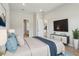 Spacious bedroom with a large bed, TV, and access to the bathroom and other rooms at 3158 Sailing Pier Ave, Winter Garden, FL 34787