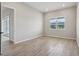 Bright, spacious bedroom featuring wood-look tile floors, and a large window at 3158 Sailing Pier Ave, Winter Garden, FL 34787