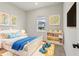 Colorful bedroom with playful decor, a bright window, and ample storage at 3158 Sailing Pier Ave, Winter Garden, FL 34787
