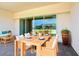 Inviting outdoor patio with a dining table, comfortable seating, and views of the surroundings at 3158 Sailing Pier Ave, Winter Garden, FL 34787