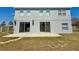 Backyard of home, featuring patio, sliding glass doors, and a fenced yard at 539 Lakeview Dr, Poinciana, FL 34759