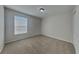 Neutral bedroom with carpet flooring, a closet, and a window for natural light at 539 Lakeview Dr, Poinciana, FL 34759