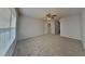 Cozy bedroom with a ceiling fan, neutral carpet, and bright natural light at 539 Lakeview Dr, Poinciana, FL 34759