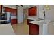 Modern kitchen with granite countertops, stainless steel appliances, and a breakfast bar at 539 Lakeview Dr, Poinciana, FL 34759