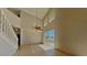 Spacious living room showcasing tile flooring, high ceilings, and a sliding door that leads to a backyard at 539 Lakeview Dr, Poinciana, FL 34759