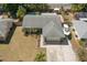 Aerial shot of the property featuring a well-maintained lawn and boat parking at 934 W Heron Cir, Winter Haven, FL 33884