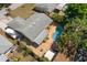 Aerial view featuring the roof, boat, pool, and the home's outdoor living space at 934 W Heron Cir, Winter Haven, FL 33884