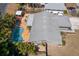 Stunning aerial view of a home featuring a private pool surrounded by lush tropical landscaping at 934 W Heron Cir, Winter Haven, FL 33884