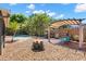 Entertaining backyard with a fire pit, pool, and pergola at 934 W Heron Cir, Winter Haven, FL 33884