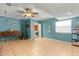 Spacious bonus room with tile flooring and convenient laundry closet at 934 W Heron Cir, Winter Haven, FL 33884