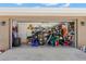 View of an open and cluttered garage space with various storage items at 934 W Heron Cir, Winter Haven, FL 33884