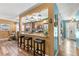 Open kitchen featuring granite counters, stainless steel appliances, wood floors, and bar seating at 934 W Heron Cir, Winter Haven, FL 33884