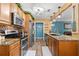 Modern kitchen featuring granite countertops, stainless steel appliances, and wood flooring at 934 W Heron Cir, Winter Haven, FL 33884