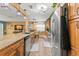 Modern kitchen featuring granite countertops, stainless steel appliances, and wood flooring at 934 W Heron Cir, Winter Haven, FL 33884