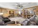 Open-concept living room with wood floors, neutral rug, breakfast bar and combined kitchen at 934 W Heron Cir, Winter Haven, FL 33884
