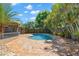 Private backyard oasis featuring a kidney-shaped pool and patio at 934 W Heron Cir, Winter Haven, FL 33884