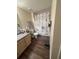 Clean bathroom with a floral shower curtain and a vanity at 3324 Parkchester Square Blvd # 102, Orlando, FL 32835