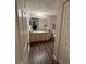 Neutral bathroom features a spacious vanity and a large mirror at 3324 Parkchester Square Blvd # 102, Orlando, FL 32835