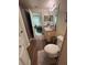 Functional bathroom with vanity, toilet, and shower/tub combo; bedroom is visible in background at 3301 Soho St # 102, Orlando, FL 32835