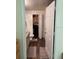 Neutral bathroom with a walk-in closet, wood floors, vanity and closed-door toilet at 3301 Soho St # 102, Orlando, FL 32835