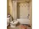 Standard bathroom with a shower and tub combination and neutral tile at 3337 Soho St # 103, Orlando, FL 32835