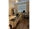 Well-lit bedroom with a ceiling fan, bed, desk and chair perfect for relaxing and getting work done at 3324 Parkchester Square Blvd # 102, Orlando, FL 32835