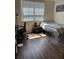 Well-lit bedroom with a large window, desk, and sleek, modern decor at 3301 Soho St # 102, Orlando, FL 32835