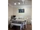 Bright dining area showcasing a modern table with bench seating and stylish decor at 3324 Parkchester Square Blvd # 102, Orlando, FL 32835