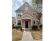 Inviting two-story house with a covered entrance and a well-maintained walkway at 3337 Soho St # 103, Orlando, FL 32835