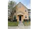 Inviting two-story townhome featuring a charming front porch and well-maintained landscaping at 3301 Soho St # 102, Orlando, FL 32835