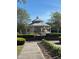 Community gazebo for relaxing, surrounded by mature trees and hedges at 3337 Soho St # 103, Orlando, FL 32835