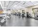 Community gym with exercise machines and weights in a well-lit space at 3337 Soho St # 103, Orlando, FL 32835