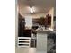 Functional kitchen with wood cabinets, stainless steel appliances, and ample counter space at 3324 Parkchester Square Blvd # 102, Orlando, FL 32835