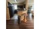Kitchen featuring a breakfast bar and black appliances at 3337 Soho St # 103, Orlando, FL 32835