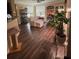 Cozy living room with hardwood floors, neutral walls and plenty of sunlight at 3337 Soho St # 103, Orlando, FL 32835