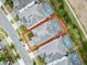 Aerial view of a single Gathering home with a screened pool, landscaping, and a driveway at 1568 Maidstone Ct, Davenport, FL 33896