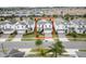 Beautiful aerial view of a two-story home nestled in a community of similarly designed homes, with a front yard at 1568 Maidstone Ct, Davenport, FL 33896